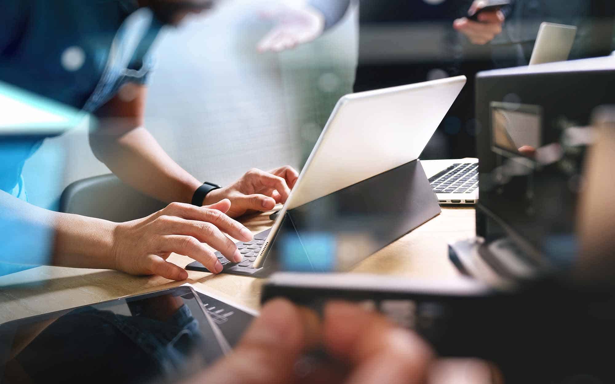 StartUp Programming Team. Website designer working digital table
