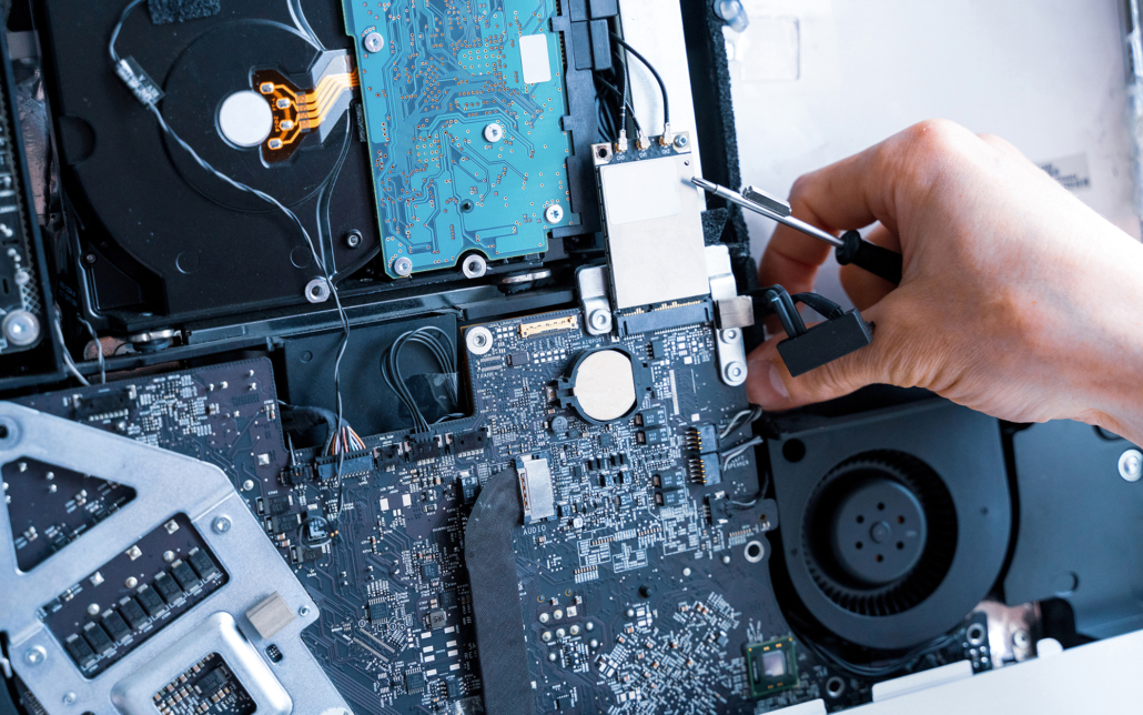 person repairing a laptop