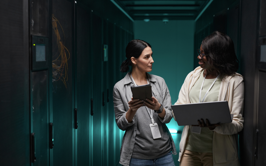 two people in a data center