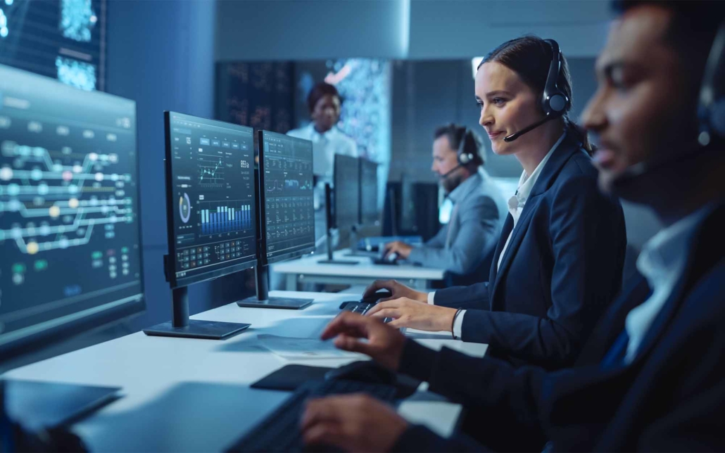 Technical Customer Support Specialist Having a Headset Call while Working on a Computer