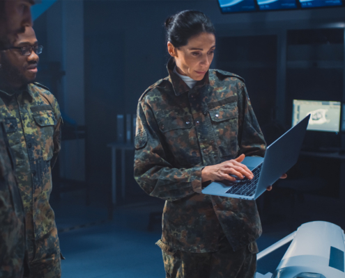 Female Leader Holds Laptop Computer Talks with Male Specialist