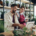 Shop assistants with laptop working in potted plant store, small business concept