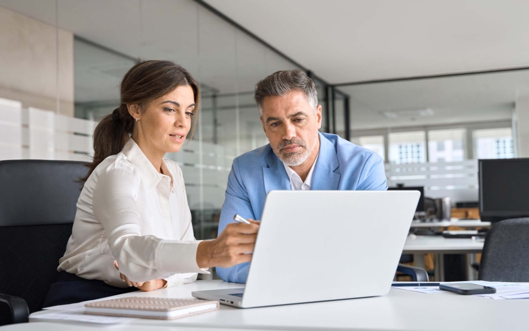 Cybersecurity Roadmaps for CTOs - Two Business Workers Looking At Laptop 1030x644 